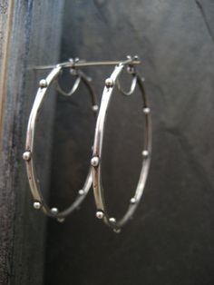 This item is made to order please allow 5 to 8 business days for your order to ship. Here you have a great alternative to the classic hoop, they are very versatile and can easily be worn from day into night. These hoops were hand carved in wax and cast in .925 solid sterling silver, finished with my signature process and light oxidizing, to give them an organic feel. Any imperfections are left intentionally, as it is a characteristic of my jewelry. They measure a little less than 1 3/4 inches in Everyday Metal Hoop Earrings With Oxidized Finish, Small Hoop Earrings With Oxidized Finish, Everyday Small Hoop Earrings With Oxidized Finish, Minimalist Hand Forged Circle Hoop Earrings, Small Sterling Silver Hoop Earrings With Oxidized Finish, Sterling Silver Hoop Earrings With Oxidized Finish, Sterling Silver Oxidized Hoop Earrings, Adjustable Oxidized Finish Hoop Earrings, Small Hoop Hand Forged Everyday Earrings