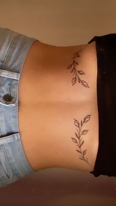 a woman's stomach with leaves on it