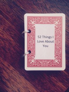 a card with the words 52 things i love about you on it sitting on a table