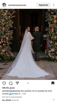 the bride and groom are getting married in front of an arch with flowers on it