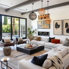 a living room filled with furniture and lots of windows