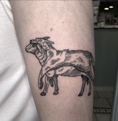 a black and white drawing of two sheeps on the left arm, one standing up