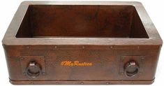 an old fashioned brown metal box with two handles on the front and one in the back