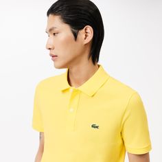 Lacoste upped the stakes in elegant sportswear game with the invention of the polo shirt in 1933. The Original L.12.12, featuring a collar, a button band and a new knit fabric, was born. The historic slim fit design features a fitted cut. Made from over 12 miles of thread, with an embroidered crocodile made up of 2367 stitches… a lesson in expertise. Classic Golf Polo Shirt With Ribbed Collar, Fitted Polo Shirt With Ribbed Collar For Golf, Classic Polo Shirt With Ribbed Collar For Golf, Fitted Classic Polo Shirt With Johnny Collar, Classic Fitted Collared Polo Shirt, Classic Polo Shirt With Seamless Collar For Golf, Classic Golf Polo Shirt With Seamless Collar, Classic Fitted Polo Shirt With Ribbed Collar, Classic Polo Shirt With Polo Collar