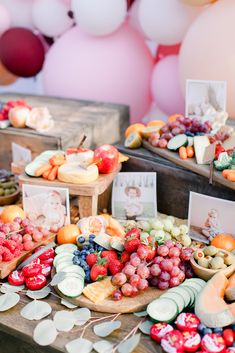 a table topped with lots of different types of fruits and veggies on it