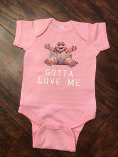 "This adorable baby bodysuit was inspired from the hit 90's television show \"Dinosaurs\". Pictured on the baby bodysuit is the character Baby Sinclair and his infamous quote from the show \"Gotta Love Me\". The designs is made with professional vinyl and pressed with a machine for longer lasting wear. Our baby bodysuits and infant shirts are 100% soft cotton. *Please message us if you have questions, we are very responsive." Dinosaur Photo, 90s Tv Show, 90s Tv, Body Suit With Shorts, Baby Shirts, Adorable Baby, Baby Size, Infamous, Gender Neutral Baby