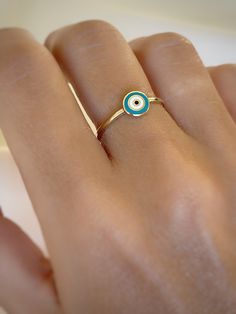 Dainty 14k Solid Gold Evil Eye Ring. It was created to protect against luck and misfortune. Perfect for daily use. Christmas  ✪ Handmade / Handcrafted Fine Jewelry  ✪ Gold Weight: Approx. 1.37g (Based on size 6)  ✪ Metal:  14K Solid Gold   ✪ Band Width:   ✪ Gold Color: White gold, Rose gold, Yellow gold  ✪100% 14K Real Gold. Not Filled or Plated. They are real 14k (585k) Gold! ♡ For questions or special designs, please contact us via message. We are happy to hear from our customers and always respond quickly. Comments are always valuable. 🎁 TRANSPORTATION You can put your choice in the cart, it will be in stock and shipped within 24 hours! . Deliveries are made within 3-5 days. We are not responsible for customs duties incurred during international orders. ☎ Please leave your phone number 14k Yellow Gold Enamel Ring Gift, Yellow Gold Evil Eye Round Ring, Spiritual 14k Gold Tarnish Resistant Rings, 14k Gold Enamel Open Ring For Promise, Minimalist 14k Gold Enamel Ring, 14k Gold Yellow Gold Enamel Ring, Spiritual 14k Yellow Gold Rings, 14k Gold Open Enamel Promise Ring, Yellow Gold Evil Eye Ring