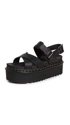 PRICES MAY VARY. EVA sole Crisscross straps, Platform profile and contrast welt stitching, Soft, molded footbed Heel: 2.75in / 70mm, Platform: 2.25in / 60mm Adjustable buckle straps Open toe A summertime classic gets the Dr. Martens treatment. These platform sandals feature the label's trademark contrast stitching and a super-comfortable molded footbed. Dr Martens Voss Ii, Dr Martens Voss, Dr Martens Womens, Sandal Platform, Karen Walker, Goodyear Welt, Sandals Black, Velcro Straps, Platform Wedges