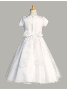 Gorgeous First Communion dress by Lito for your sweet girl. Short sleeve tea length style in white with round neckline satin bodice and crystal organza skirt. Features zipper closure and bow tie at the back. Whether your daughter is attending a communion, wedding, or other special event, this dress is the perfect choice for a truly unforgettable look. And if you have a younger daughter who also needs a dress, be sure to check out our original Lito Girls White Short Sleeve Crystal Organza Communi Girls First Communion Dresses, Girls Communion Dresses, First Communion Dress, Baptism Gown, Off Shoulder Gown, Organza Skirt, First Communion Dresses, Baptism Dress, Communion Dresses