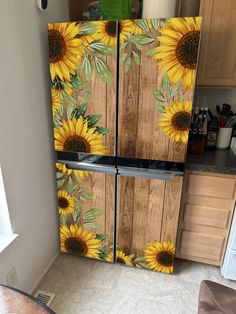 a refrigerator with sunflowers painted on it