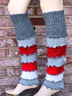 the legs of a woman wearing socks with ruffles on them, standing next to a brick wall