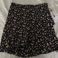 Bought From Dillards Has A Stretchy Waistband Black Floral Print Skirt For Summer, Fitted Black Bottoms For Brunch, Black Ruffle Hem Mini Skirt, Black Mini Skirt For Beach In Spring, Black Ruffle Hem Mini Skirt For Spring, Black Ruffled Mini Skirt For Summer, Black Mini Skirt With Ruffle Hem, Black Floral Print Skirt For Day Out, Fitted Black Skirt For Brunch