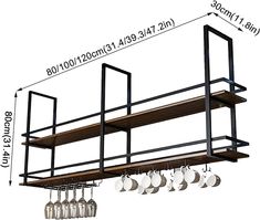 a kitchen rack with pots and pans hanging from it's side, next to an empty wine glass holder