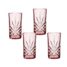 four pink glasses sitting next to each other on a white surface with one glass in the middle