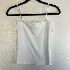 Nwot Brandy Melville White Camisole Os , No Flaws Noted Stretchy Approx. Measurements Length 19.5in P2p 13in Fitted Casual Camisole For Daywear, Fitted Tank Strap Tops For Daywear, Fitted Tops With Tank Straps For Daywear, Fitted Tank Tops For Day, Fitted Cotton Camisole For Daywear, Fitted Top With Adjustable Straps For Daywear, Fitted Tank Top For Daywear, Casual Fitted Tank Top For Daywear, Fitted Vest Top For Daywear