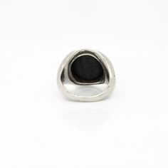 A fine antique signet ring.  In solid silver.  Bezel-set with an antique 18th Century Wedgwood & Bentley black basalt stoneware intaglio seal.  The intaglio depicts Harpocrates standing in the boat of the Sun.  Marked to the reverse Wedgwood & Bentley and with the model no. 136.  For the comparisons - please see the related intaglio in the British Museum's collection: inventory no. 1887,0307,I.392..  Harpocrates is also Horus, the Egyptian god of the sun. He's wearing a corn measure on his head, the club of Hercules in his left hand, and is in a boat of papyrus with two peacock head terminals.   Simply a wonderful antique Wedgwood & Bentley ring!  Date: Late 18th Century  Condition Details: There is a light tear to the bezel, two marks to the top, and light surface wear throughout. Otherwi Antique Silver Intaglio Ring, Classic Engraved Enamel Ring, Classic Sterling Silver Intaglio Ring, Classic Engraved Signet Ring For Memorial, Sterling Silver Signet Ring With Intaglio, Antique Carved Signet Ring, Antique Black Enamel Signet Ring, Silver Engraved Intaglio Ring, Formal Sterling Silver Signet Ring With Intaglio