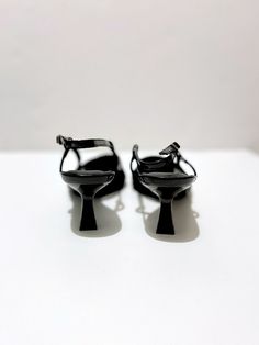 A staple to our capsule collections, these black close-toe kitten heels are perfect for you! They're so cute, stylish and comfortable that it's impossible to feel confident walking in these low-heeled shoes. Best of all, these heels are timeless - always in style. Pair them with a classy bodycon dress for a feminine chic office look or pair them with a blouse and jeans for a feminine causal look.     Why You'll Love These Black Kitten Heels      Low Heel, Pointed Toe : We get it, not everyone lo Sleek Kitten Heels With 4-inch Heel For Spring, Chic Kitten Heels With Padded Block Heel, Chic Pointed Toe Kitten Heels With Padded Heel, Chic Kitten Heels With Padded Heel And Pointed Toe, Chic Medium Width Pointed Toe Kitten Heels, Kitten Heels With Heel Strap For Night Out, Modern Kitten Heels With Padded Block Heel, Sleek Ankle Strap Kitten Heels With Padded Heel, Sleek Kitten Heels With Ankle Strap And Padded Heel