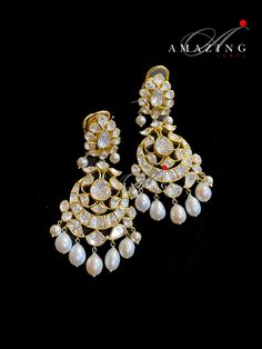 Silver Moissanite Polki Earring, Kundan Chandelier Bridal Jewelery, Traditional Jewelery 925 Silver Earring,18K Plated, Wedding Jewelery Statement Earring Drop Pearl Earring Material : Silver Gemstone: Moissanite, Drop Pearl Stone colour: Uncut Polki Primary colour: Gold Size-Length60mm Width:30mm Closure : Screw back and Clips Silver Intricate, hand crafted, Pure Silver Polki Earrings, studded with high quality Moissanite Polki comes with screw back and clips, made in 92.5 silver with 22ct gold Yellow Gold Chandbali Chandelier Earrings For Wedding, Elegant Kundan Chandelier Earrings, White Hand Set Chandelier Earrings For Celebrations, Elegant Heavy Chandbali Bridal Earrings, Traditional Round Chandelier Earrings With Elegant Design, Hand Set Diamond Chandbali Chandelier Earrings, Diamond Chandbali Bridal Earrings For Wedding, Dazzling Chandbali Bridal Earrings For Formal Occasions, Festive Diamond Chandelier Earrings For Weddings