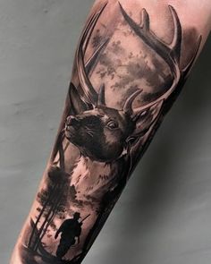 a man with a deer tattoo on his arm