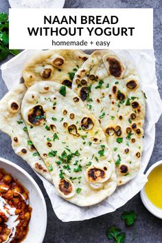 homemade naan bread without yogurt on a plate next to bowls of sauce