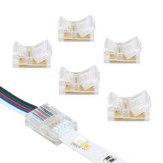 four white leds with wires attached to them