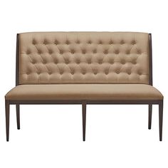 a beige couch with wooden legs and an upholstered headboard on the back