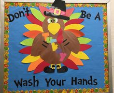 a bulletin board with a turkey wearing a pilgrim hat