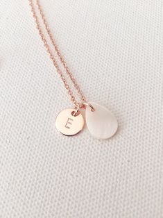 "Custom bridesmaid necklace, personalised initial necklace, bridesmaids gifts, wedding gifts, bride necklace, wedding jewellery, bridesmaids Personalised rose gold initial necklace with drop shape mother of pearl charm. Beautiful custom necklace for your bridesmaids. DETAILS Rose gold plated initial charm 10mm Mother of pearl charm 13m PERSONALISATION Please choose the INITIAL and LENGTH from drop menu. The jewelry come in a gift box seen on the picture. If your order is a gift, I would be happy to include a personal note for you. Please just put the note you wish to send in the \"Notes To Seller\" section when you checkout. Thank you :)" Personalized Rose Gold Initial Necklace For Wedding, Rose Gold Name Necklace For Wedding, Personalized Rose Gold Charm Necklaces For Wedding, Personalized Rose Gold Charm Necklace For Wedding, Initial Pendant Necklace For Bridesmaid Gift, Dainty Initial Pendant Necklace As Bridesmaid Gift, Dainty Initial Necklace For Bridesmaids, Initials Necklace For Bridesmaid Gift, Rose Gold Initial Necklace For Wedding