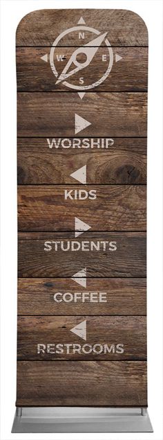 a wooden sign that says worship, kids, students, coffee and restrooms on it