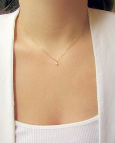 "Our CZ Tiny Rose Necklace is so petite and feminine! The sparkling cubic zirconia charm hangs from a 14K gold or rose gold filled chain. This is the perfect gift for a friend as it is so dainty and ready for everyday wear. ---------------------- FEATURES ◊ Tiny Cubic Zirconia charm (4mm x 7mm) ◊ 14K gold filled or rose gold filled chain ◊ Model is wearing 17\" length ◊ All necklace findings (clasp, jump rings, tag) & chain are 14K gold filled to ensure the highest quality piece ------------ Dainty Rose Necklace, Choker Gold Necklace, Dainty Rose Gold Necklace, Trendy Accesories, Rose Gold Choker, Gold Necklace Dainty, Preppy Dress, Dainty Gold Chain, Choker Gold