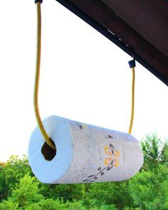 a roll of toilet paper hanging from a ceiling