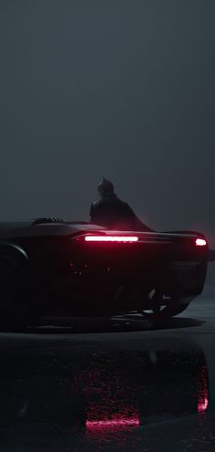 a futuristic car is shown in the dark