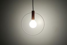 a light that is hanging from a ceiling in a room with no one around it