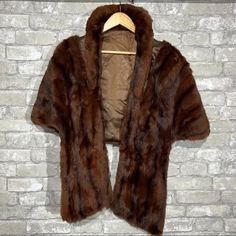 "Vintage 1950s Skinner Women's Genuine Fur Shawl Stole Wrap Satin Lined Soft Fur BRAND: Skinner SIZE: One Size Fits Most (measurements in description) ITEM: vintage stole/shawl. genuine fur. soft silky fur. satin lined with logo. pop up collar. hook and eye closure COLOR: brown MATERIAL: fur and satin CONDITION: excellent preowned FLAWS: none FLAT MEASUREMENTS APPROXIMATELY: Length to end of hem: 18\" Length to end of 'scarf': 29\" Across Hem: 30\"" 1950s Coat, 1950’s Fashion, Mink Jacket, 1950s Outfits, Mid Century Fashion, Fur Coat Vintage, 1950 Vintage, Fur Shawl, Mink Coat