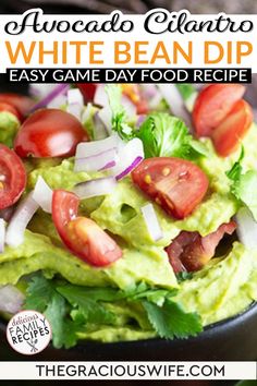 avocado and tomato white bean dip recipe in a black bowl with text overlay