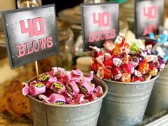 two buckets filled with candy sitting next to each other