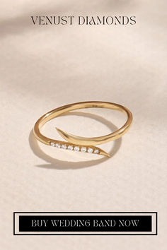 a gold ring with diamonds on it and the words, buy wedding band now