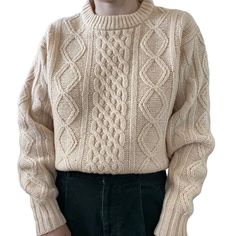 This vintage Thane sweater from the 1960s is a beautiful cream color with a classic fisherman style. It features a cozy cable-knit pattern, crew neckline, and long sleeves. The sweater is made from 100% wool and has a chunky knit texture that adds to its vintage charm. The size is a women's L, and the sweater has a pullover style. This sweater is perfect for adding a touch of retro style to any outfit. Size L Color: ivory  Material: 100% wool Note, there are 2 small holes on the front (pic 7 & 8 Retro Cable Knit Sweater For Fall, Classic Chunky Knit Cream Sweater, Cream Chunky Knit Classic Sweater, Classic Cream Chunky Knit Sweater, Vintage Textured Knit Sweater, Retro Beige Knitted Sweater, Beige Knitted Retro Sweater, Retro Crew Neck Cream Sweater, Vintage Beige Knitted Sweater