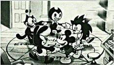 an old black and white photo of cartoon characters