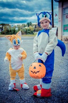 two children dressed up as tails the cat and pumpkin