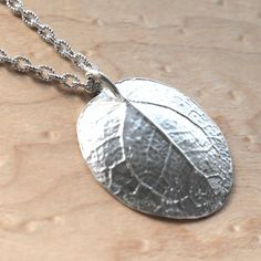 Discover the essence of the Chinese Money Plant with this unique handcrafted silver pendant! This leaf is a genuine one-of-a-kind piece, lovingly crafted in my goldsmith workshop. 🍀 The handcrafted design of the pendant and the symbolic significance of the plant imbue the jewelry piece with a special depth and meaning. Such symbols can provide the wearer with a sense of protection and positive influences, by focusing thoughts and attention on positive aspects like prosperity and good fortune. ? Chinese Money Tree, Plant Jewelry, Chinese Money Plant, Money Plant, Money Tree, Nature Necklace, Luck Charm, Leaf Pendant, Pendant Silver