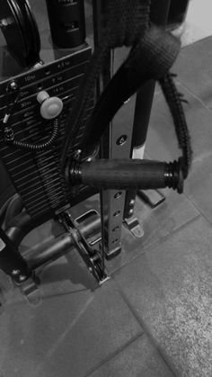 a black and white photo of an old fashioned machine with wires attached to the side