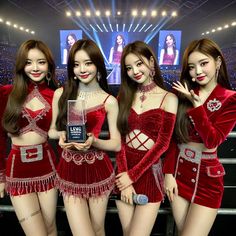 the girls in red outfits are posing with an award