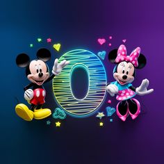 mickey and minnie mouse standing next to each other in front of the number 10 sign