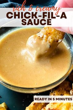 a hand dipping sauce into chicken wings in a bowl with text overlay that reads, high and creamy chick - fil - a sauce ready in 5 minutes