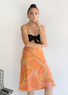 "Vintage 90s abstract silk skirt. Brightly colored abstract silk skirt perfect for the Spring / Summer season! Low-waisted fit. Flowy a-line silhouette. Below knee length. Side hook and eye and zipper fastening. Fully lined. We kindly ask that you please view all measurements for comparison so you can get your desired fit. Made in New York. * Brand: Lafayette New York 148 * Decade: 1990s * Fabric: Silk * Lining: Polyester Crepe * Color: Orange, Lime Green, Pink C O N D I T I O N Excellent vintag Summer Flowy Skirt With Abstract Print, 00’s Fashion, Lafayette New York, Spring Abstract, Fabric Silk, Silk Skirt, Model Fits, Low Waisted, Puff Sleeve Top