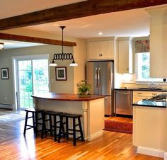 the kitchen is clean and ready to be used as a living room or dining area