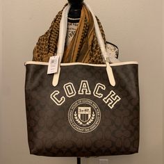 New Coach City Tote In Signature Canvas With Varsity Motif 100% Authentic. Great Bag For All Around Use. Beautiful Holiday Gift! Retail Is $428! Offers Accepted! Chic Cream Bags With Logo, Cream Logo Bags For Travel, Cream Shoulder Bag With Logo For Shopping, Cream Bags With Logo For Shopping, Beige Logo Shoulder Bag For Everyday Use, Beige Logo Bags For Errands, Cream Logo Bag For Daily Use, Luxury Coach Canvas Bag, Cream Rectangular Logo Shoulder Bag