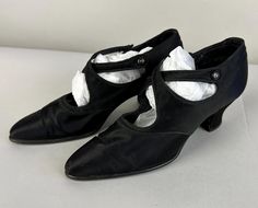 You'll glide like silk across the dance floor in these 1920's pumps! Black silk Mary Janes are given a twist with a criss crossing strap with button fastener. They have pointy toes, block heels, and leather soles. These shoes are in great vintage condition with expected wear for age. Marked size EU 37 (translates to a US Size 6.5), please see the measurements for accuracy: Insole Length: 9.5" Outer Width: 2.75" Heel Height: 2.5" Find our other vintage splendid shoes here: https://www.etsy.com/shop/OverAttiredVintage?section_id=19096587  Within the US, we ship our shoes in padded flat rate envelopes. If you would prefer them to be sent in a medium flat rate box, please choose that option at checkout. International shipments will be packaged in a box to ensure safe delivery. Every additional Vintage Fitted Closed Toe Dance Shoes, Fitted Evening Dance Shoes For Spring, Fitted Pointed Toe Evening Dance Shoes, Fitted Pointed Toe Dance Shoes For Evening, Vintage Fitted Dance Shoes For Evening, 1920s Shoes, Womens Mary Janes, Mary Jane Shoes Womens, Strap Pumps