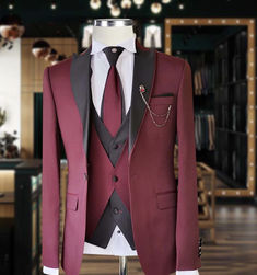 Dress to Impress with André Emilio’s bespoke suits that define sophistication. Make your mark with elegance. Bespoke Fitted Winter Suits, Elegant Burgundy Outerwear For Party, Elegant Burgundy Party Outerwear, Fitted Tuxedo Outerwear With Suit Collar, Winter Tuxedo Suit With Notch Lapel, Elegant Fall Suit For Groom, Elegant Burgundy Blazer For Party, Elegant Winter Three-piece Suit For Groom, Elegant Fall Suit For Grooms